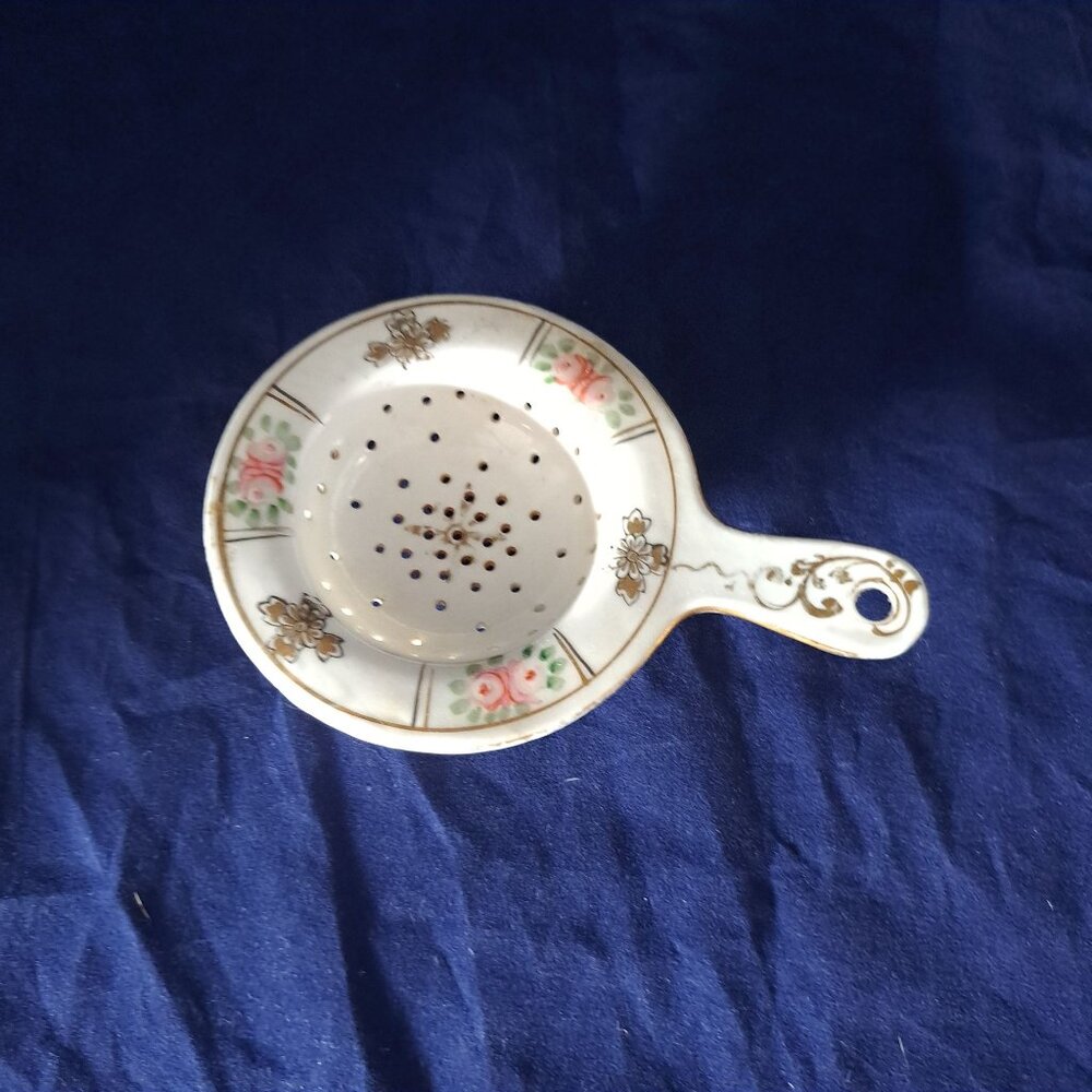 Nippon Hand Painted Porcelain Tea Strainer With Floral Design